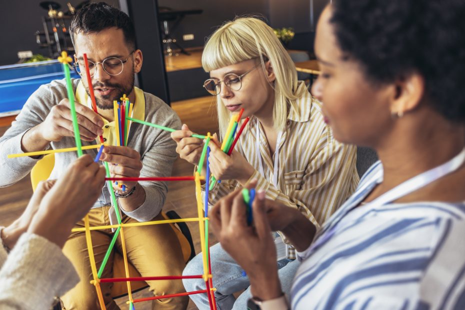 diverse team members collaborating on an activity
