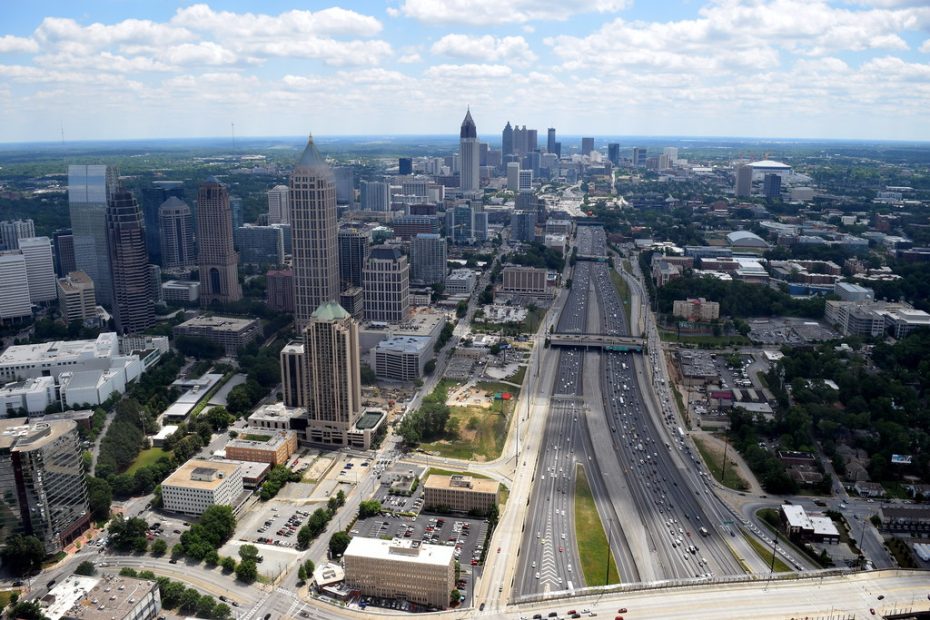 an aerial shot of Atlanta's skyline in the distance.