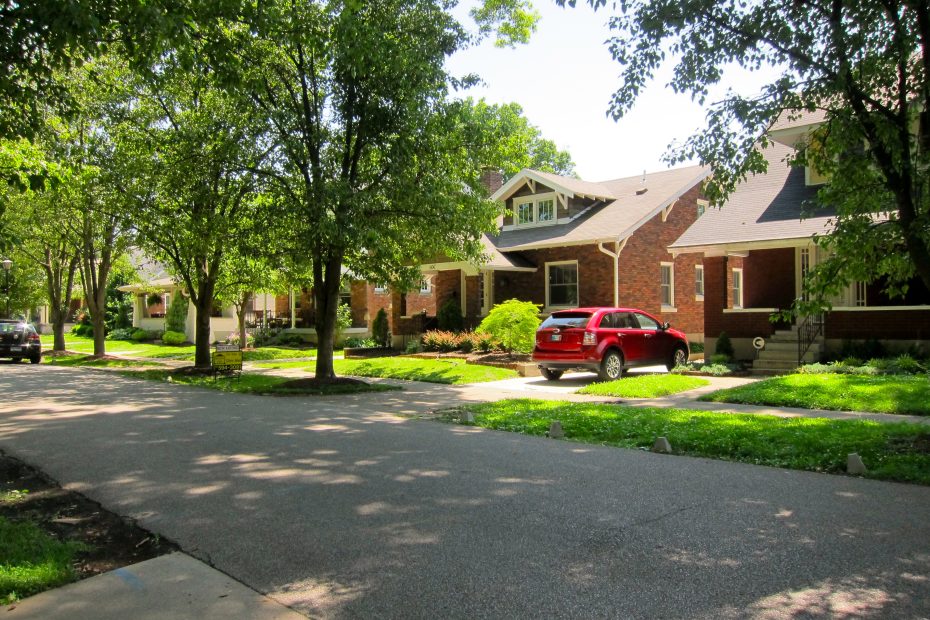 urban neighborhood with tree-lined streets and detached single-family homes.